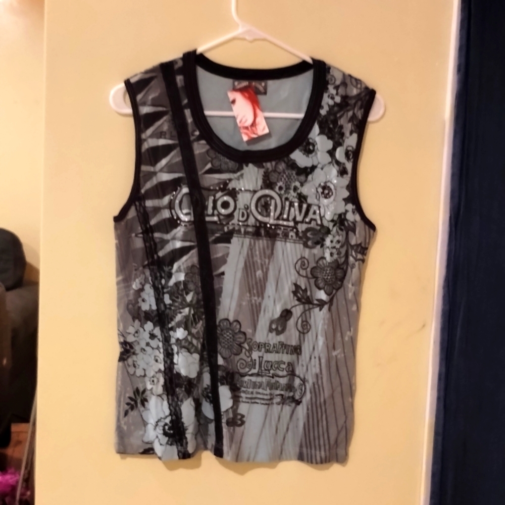 An Ebomb, turquoise tank top